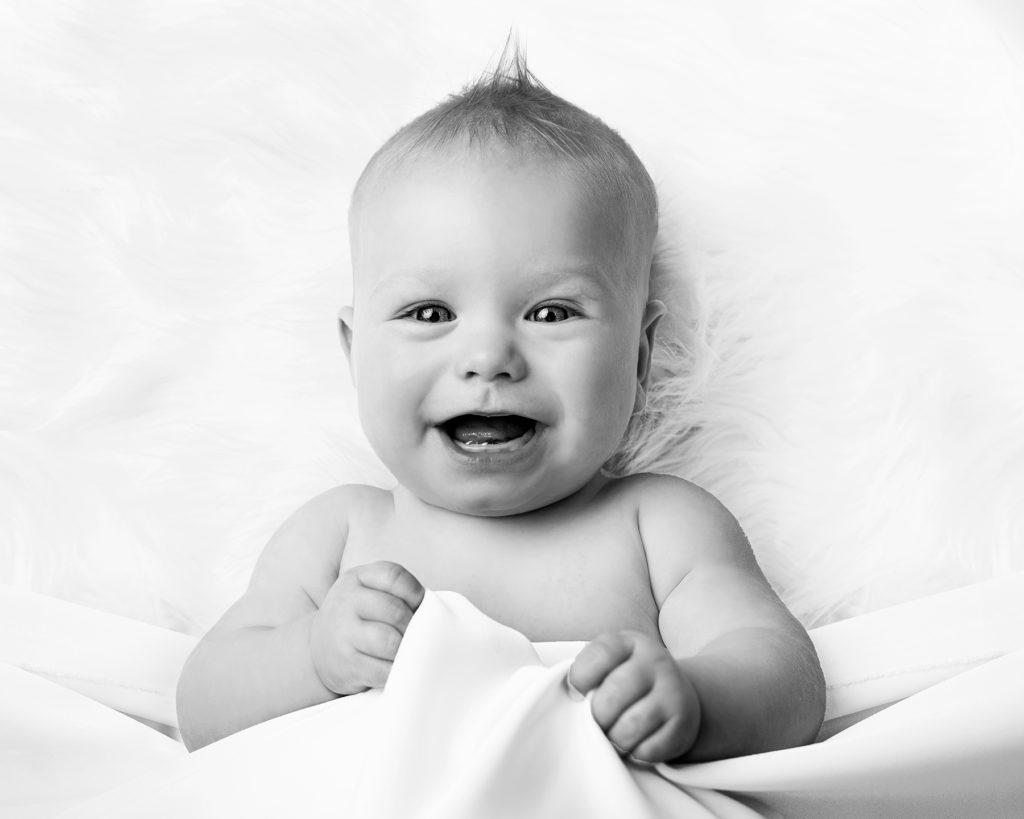 Happy smiling baby on photoshoot in Canterbury Kent