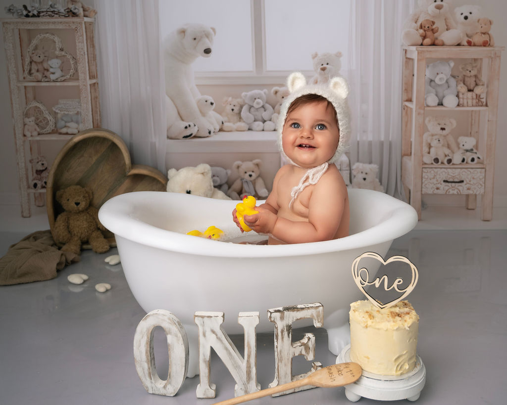 Baby girl in a bath on her cake same photoshoot in Canterbury Kent
